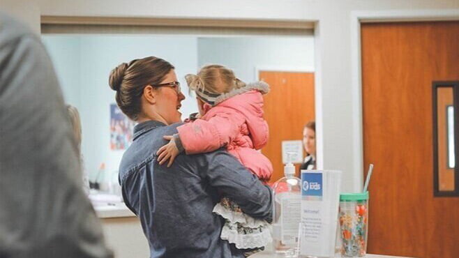 Mother holding child
