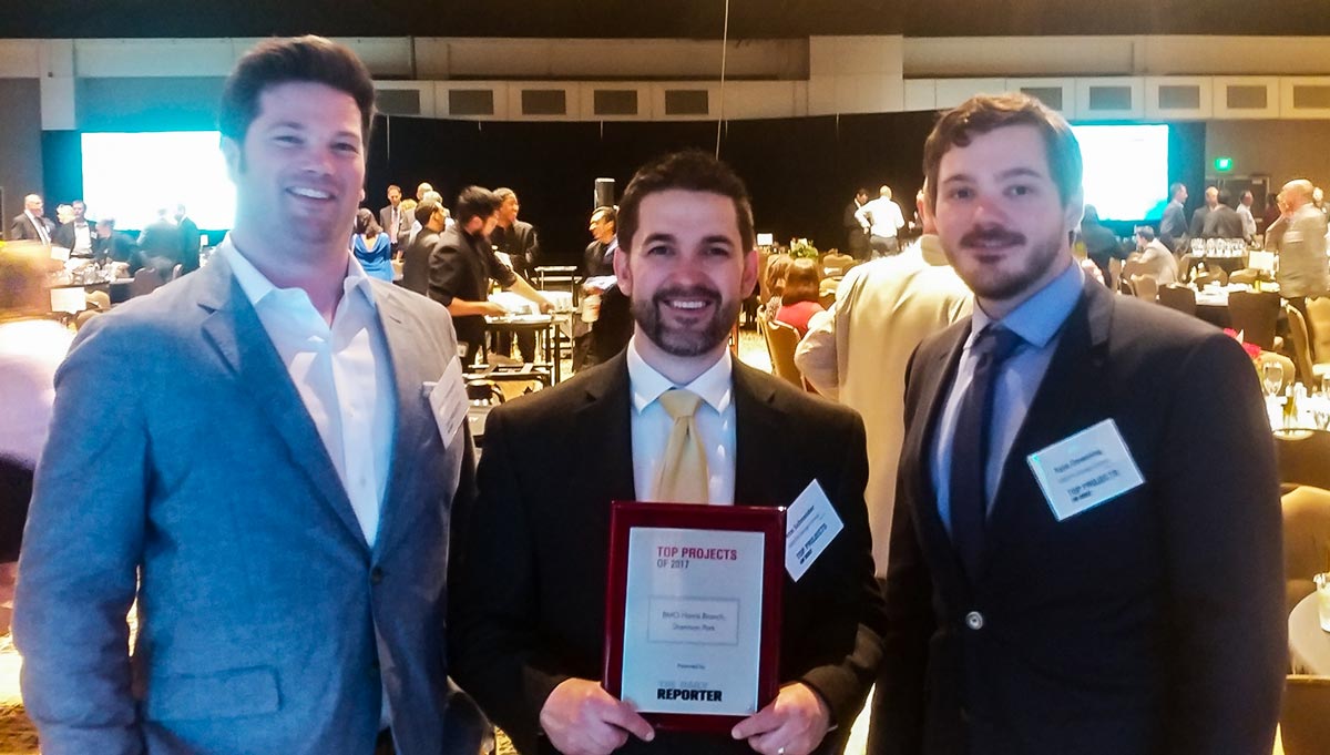 GROTH employees accepting Top Projects award